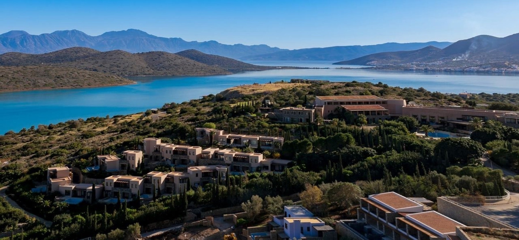 Aerial view of a resort complex on the Elounda coastline in Crete