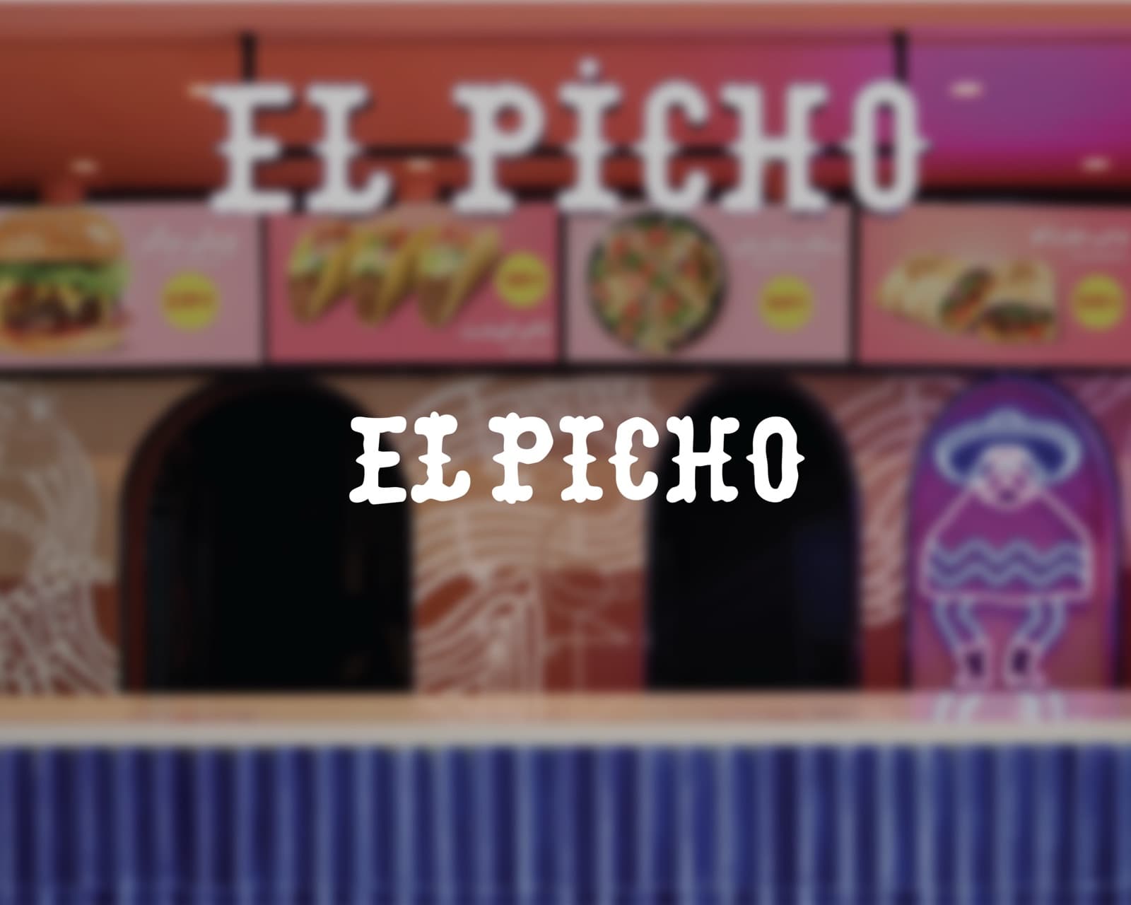 El Picho restaurant interior with neon sign and blue tiles